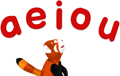 A puppet red panda looking up at red vowels in a fun font
